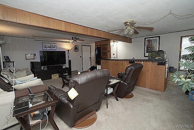 3042 Baseline Rd, Grand Island, NY 14072 - living room featuring a ceiling fan, light colored carpet, and wooden walls