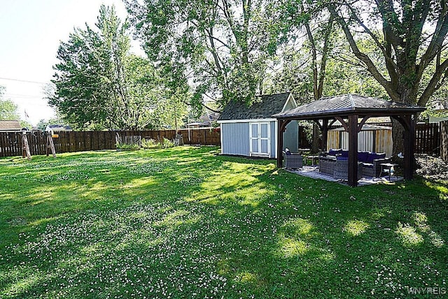3042 Baseline Rd, Grand Island, NY 14072 - fenced backyard with a gazebo, an outdoor living space, a shed, and a patio