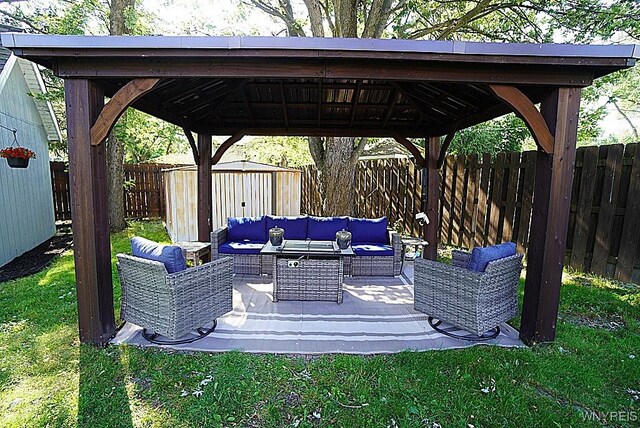 3042 Baseline Rd, Grand Island, NY 14072 - fenced backyard featuring outdoor lounge area, a gazebo, and a storage shed