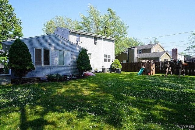 3042 Baseline Rd, Grand Island, NY 14072 - back of house featuring a playground and a fenced backyard