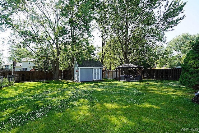 3042 Baseline Rd, Grand Island, NY 14072 - fenced backyard with a gazebo and a storage unit