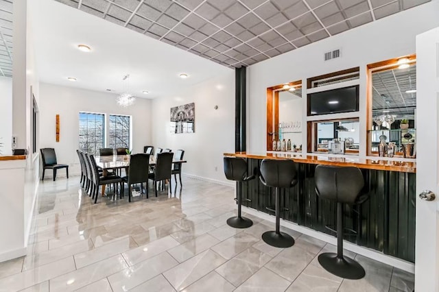 11059 Gold Seal Way, Urbana, NY 14840 - indoor bar with baseboards and hanging light fixtures