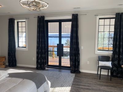 11059 Gold Seal Way, Urbana, NY 14840 - bedroom with french doors, dark wood-style floors, access to outside, and a chandelier
