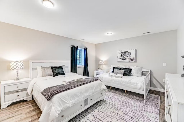 11059 Gold Seal Way, Urbana, NY 14840 - bedroom featuring light wood-style floors and baseboards