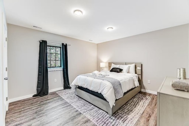 11059 Gold Seal Way, Urbana, NY 14840 - bedroom with wood finished floors and baseboards