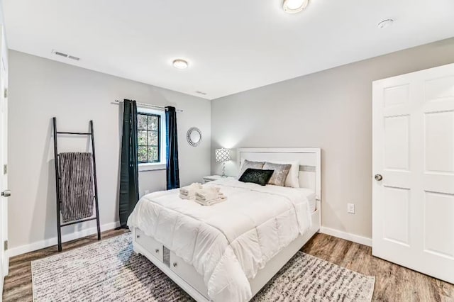 11059 Gold Seal Way, Urbana, NY 14840 - bedroom with wood finished floors and baseboards