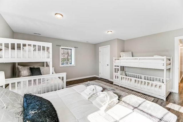 11059 Gold Seal Way, Urbana, NY 14840 - bedroom featuring baseboards and wood finished floors