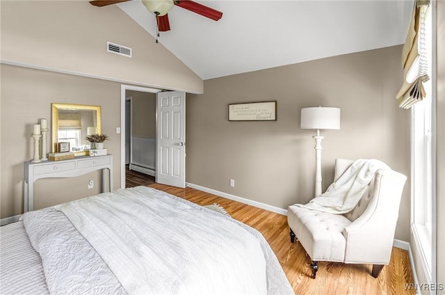 79 Hemlock Dr, West Seneca, NY 14224 - bedroom featuring a baseboard radiator, lofted ceiling, wood finished floors, and a ceiling fan