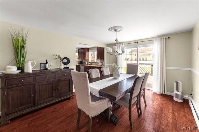79 Hemlock Dr, West Seneca, NY 14224 - dining area featuring a chandelier, a baseboard radiator, and dark wood-type flooring