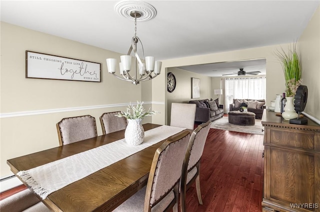 79 Hemlock Dr, West Seneca, NY 14224 - dining space featuring a chandelier and dark wood-style floors