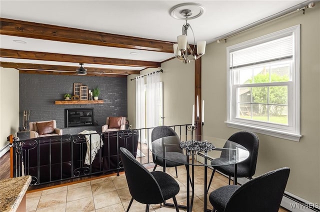 79 Hemlock Dr, West Seneca, NY 14224 - dining space with a baseboard radiator, a brick fireplace, beam ceiling, light tile patterned floors, and a chandelier