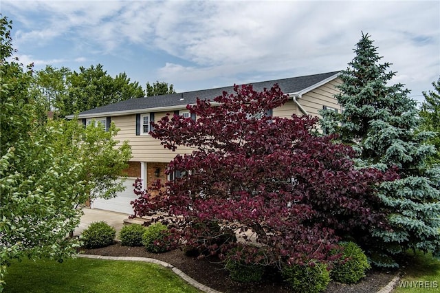 79 Hemlock Dr, West Seneca, NY 14224 - view of front of home featuring driveway, brick siding, and an attached garage