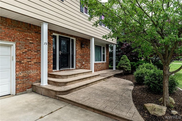 79 Hemlock Dr, West Seneca, NY 14224 - view of exterior entry featuring covered porch and brick siding
