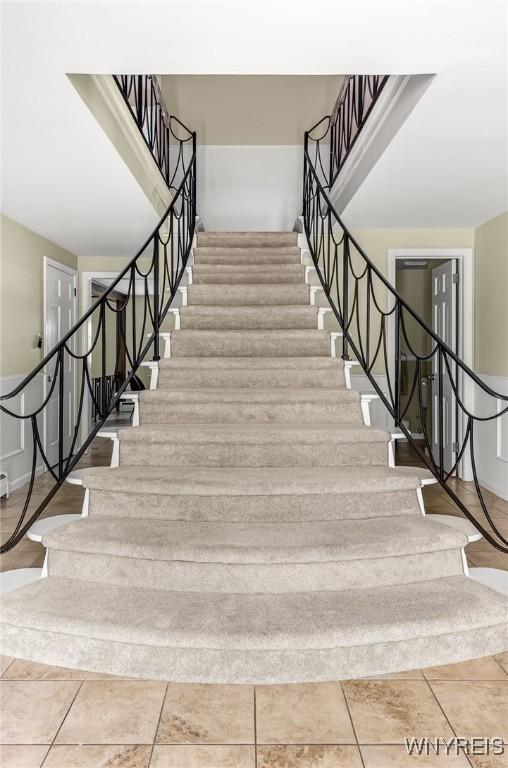 79 Hemlock Dr, West Seneca, NY 14224 - stairs featuring baseboards