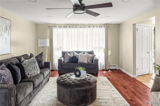 79 Hemlock Dr, West Seneca, NY 14224 - living room with ceiling fan, a baseboard radiator, and wood finished floors