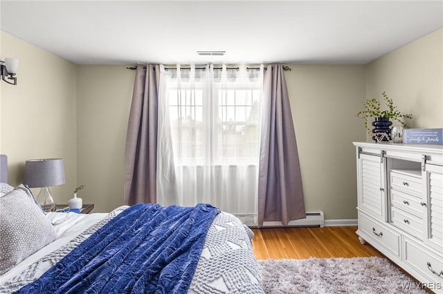 79 Hemlock Dr, West Seneca, NY 14224 - bedroom featuring light wood-style flooring and baseboards