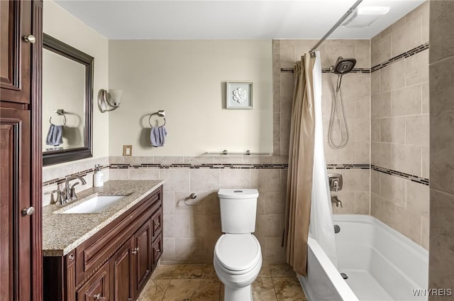 79 Hemlock Dr, West Seneca, NY 14224 - full bathroom with vanity, tile walls, shower / bath combo, wainscoting, and tile patterned floors