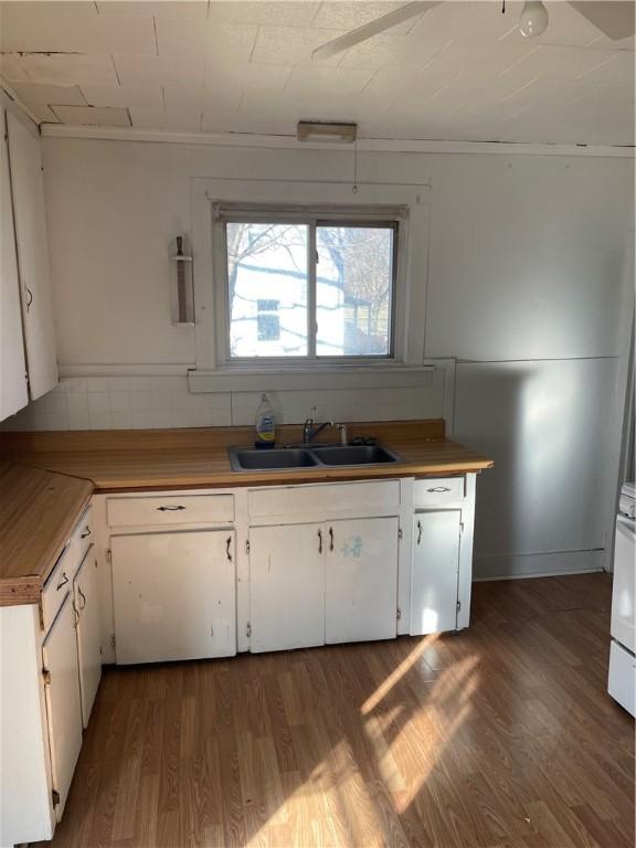 1123 Abbott St, Elmira-City, NY 14901 - kitchen with wood finished floors, white cabinetry, and light countertops