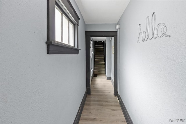 540 17th St, Niagara Falls, NY 14301 - hall featuring wood finished floors, a textured wall, and stairs
