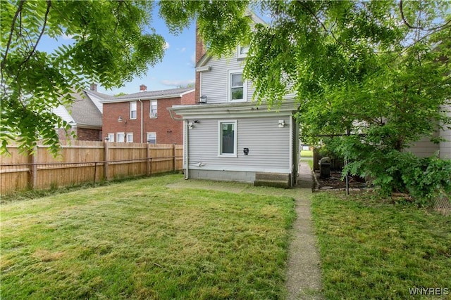 540 17th St, Niagara Falls, NY 14301 - back of property with a fenced backyard and a chimney