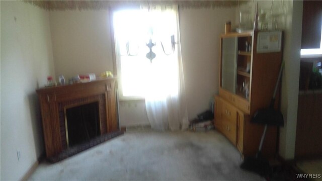 69 Holbrook St, Lackawanna, NY 14218 - living area with light colored carpet and a fireplace with raised hearth