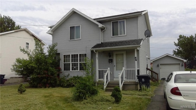 69 Holbrook St, Lackawanna, NY 14218 - traditional-style house featuring an outdoor structure, a garage, and a front yard