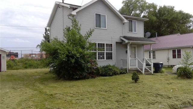 69 Holbrook St, Lackawanna, NY 14218 - rear view of property with a lawn
