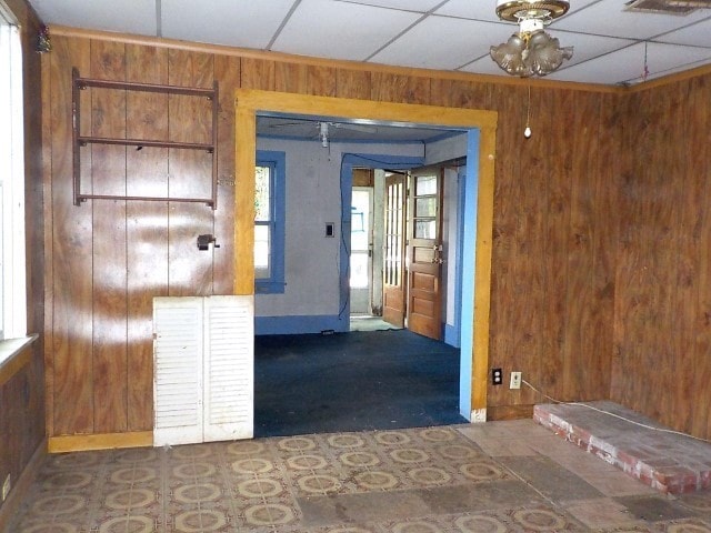 1140 N Main St, Arcadia, NY 14513 - empty room with wood walls and baseboards