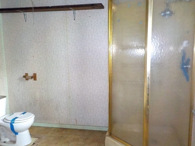 1140 N Main St, Arcadia, NY 14513 - full bathroom featuring a stall shower and wallpapered walls