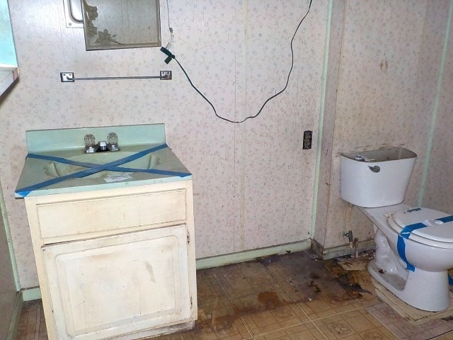 1140 N Main St, Arcadia, NY 14513 - bathroom with wallpapered walls and vanity