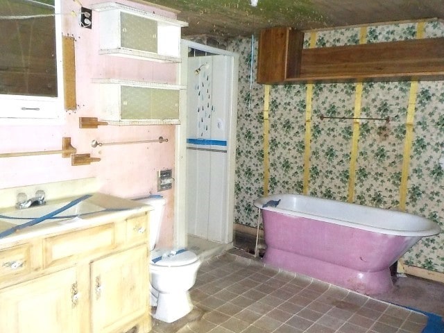 1140 N Main St, Arcadia, NY 14513 - full bath featuring a freestanding tub and vanity