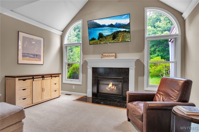 9210 Via Cimato Dr, Clarence, NY 14032 - living area featuring vaulted ceiling, carpet, ornamental molding, and a tiled fireplace