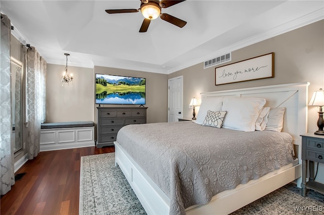 9210 Via Cimato Dr, Clarence, NY 14032 - bedroom with a chandelier, dark wood-type flooring, ornamental molding, and a ceiling fan