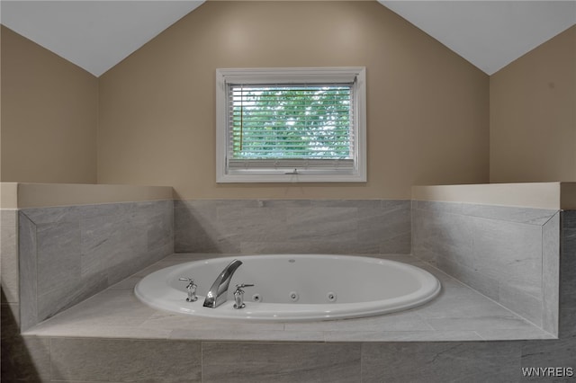 9210 Via Cimato Dr, Clarence, NY 14032 - full bath with lofted ceiling and a jetted tub