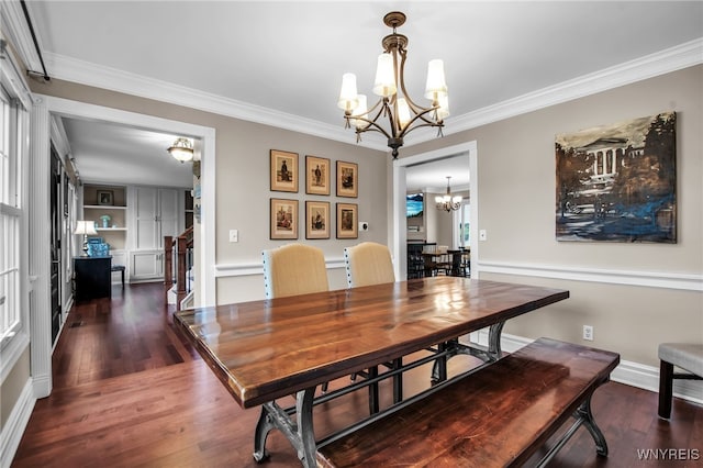 9210 Via Cimato Dr, Clarence, NY 14032 - dining space with a chandelier, ornamental molding, and wood finished floors