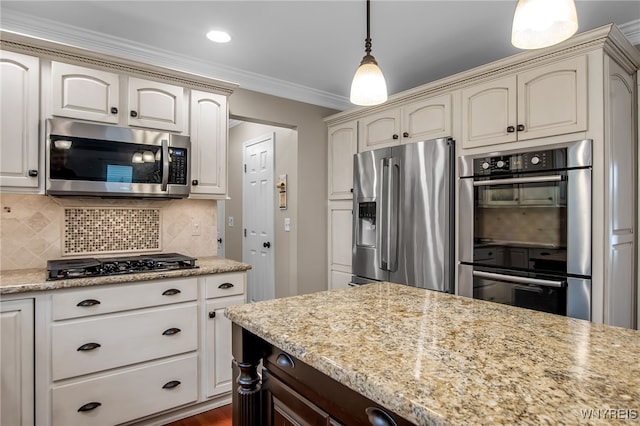 9210 Via Cimato Dr, Clarence, NY 14032 - kitchen featuring appliances with stainless steel finishes, cream cabinets, backsplash, ornamental molding, and pendant lighting
