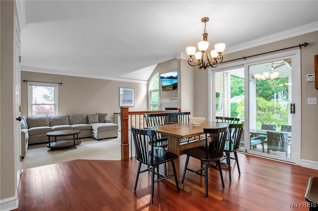 9210 Via Cimato Dr, Clarence, NY 14032 - dining room with a chandelier, crown molding, wood finished floors, and a fireplace