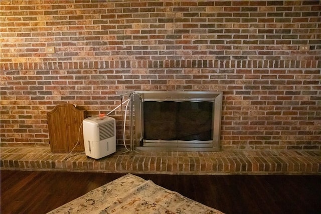 1602 Edgemere Dr, Greece, NY 14612 - detailed view of wood finished floors and brick wall