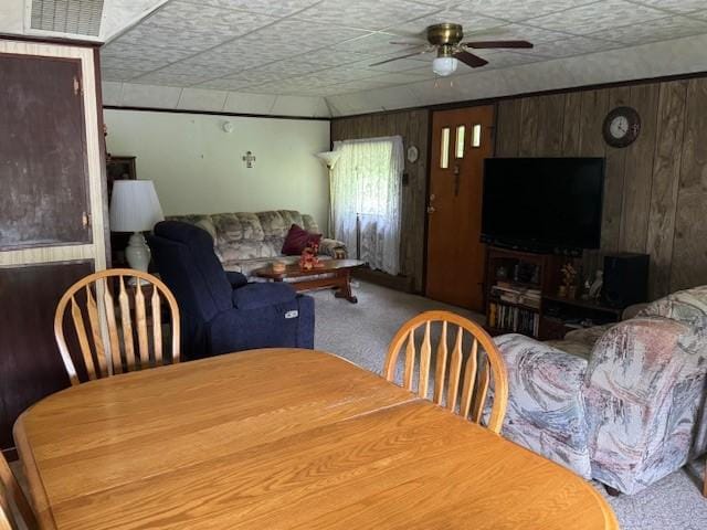 3627 Irish Ave Unit B, Willing, NY 14895 - dining room featuring carpet, a ceiling fan, and wood walls