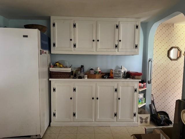 3627 Irish Ave Unit B, Willing, NY 14895 - kitchen featuring freestanding refrigerator and white cabinetry