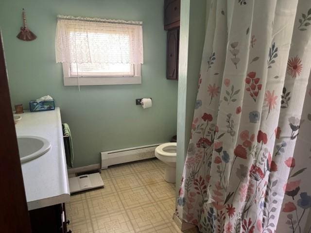 3627 Irish Ave Unit B, Willing, NY 14895 - bathroom featuring a baseboard heating unit, vanity, a shower with shower curtain, and tile patterned floors