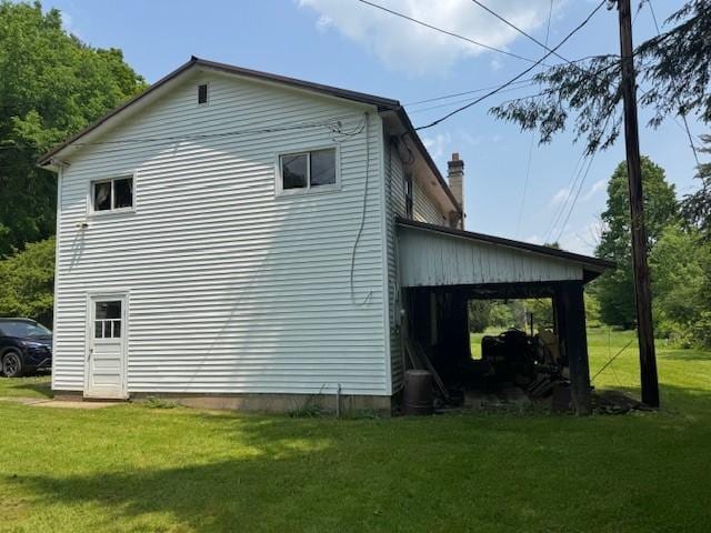3627 Irish Ave Unit B, Willing, NY 14895 - view of side of home featuring a lawn and a chimney