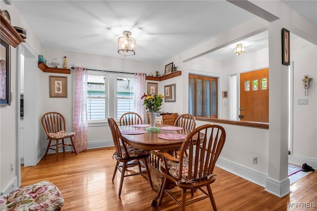 87 Pasadena Pl, Amherst, NY 14221 - dining space featuring light wood-type flooring and a chandelier