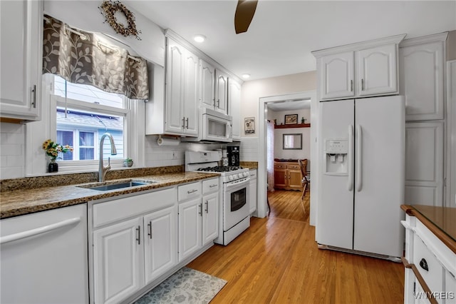 87 Pasadena Pl, Amherst, NY 14221 - kitchen featuring white appliances, white cabinetry, light wood finished floors, tasteful backsplash, and recessed lighting