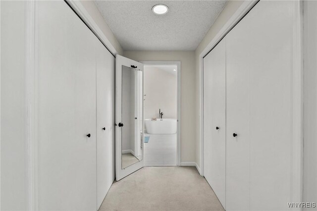 13 Thames Ct, Amherst, NY 14221 - hall featuring light colored carpet and a textured ceiling