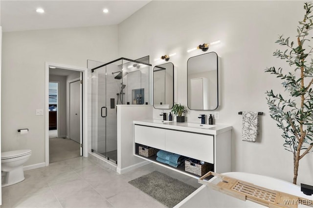 13 Thames Ct, Amherst, NY 14221 - bathroom with double vanity, a shower stall, lofted ceiling, a freestanding bath, and recessed lighting