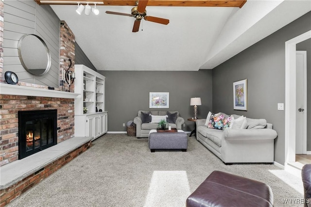 13 Thames Ct, Amherst, NY 14221 - carpeted living area with lofted ceiling, a fireplace, and ceiling fan