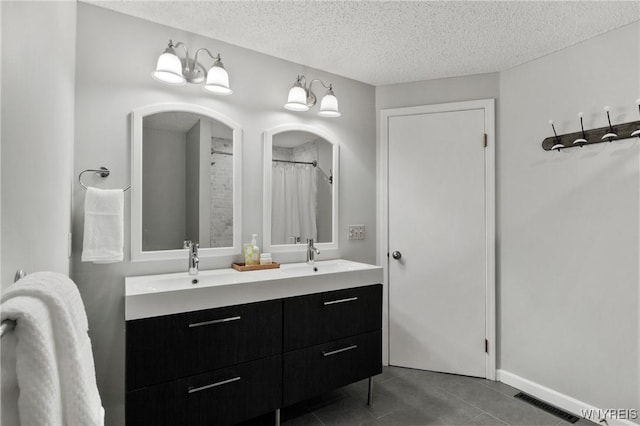 13 Thames Ct, Amherst, NY 14221 - full bathroom featuring double vanity, tile patterned flooring, and a textured ceiling