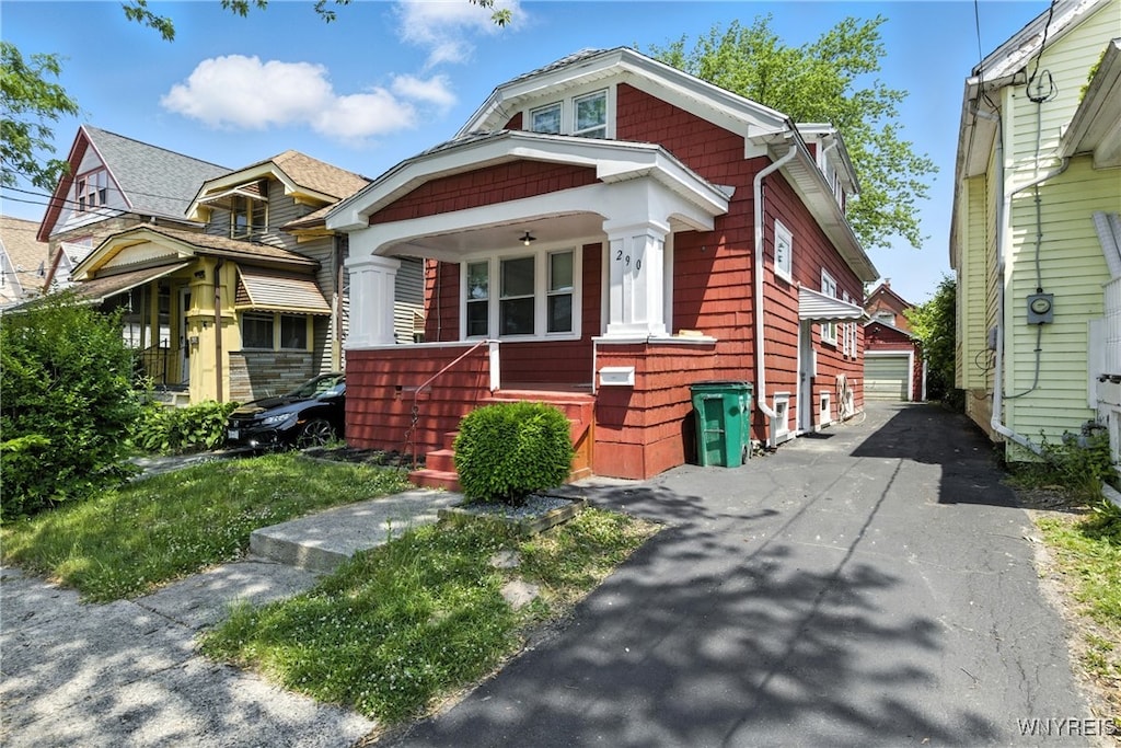 290 Crowley Ave, Buffalo, NY 14207 - view of front facade featuring covered porch, an outdoor structure, and a detached garage