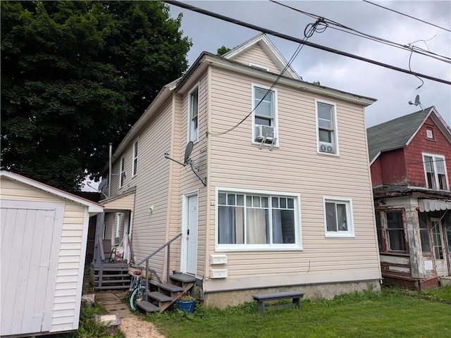 21 Charlotte Ave, Bradford City, PA 16701 - rear view of property with a shed, entry steps, cooling unit, and a lawn